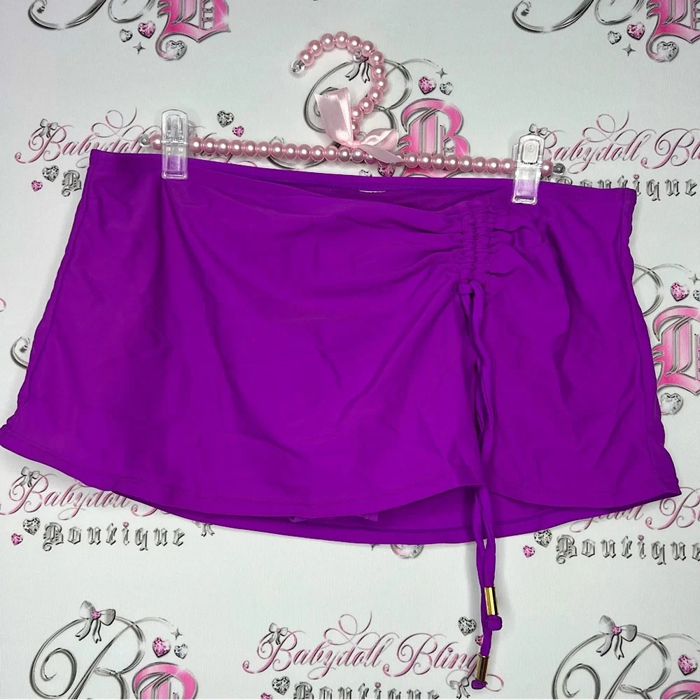 Mini skort purple bathing  suit material rutched cinched front area with gold